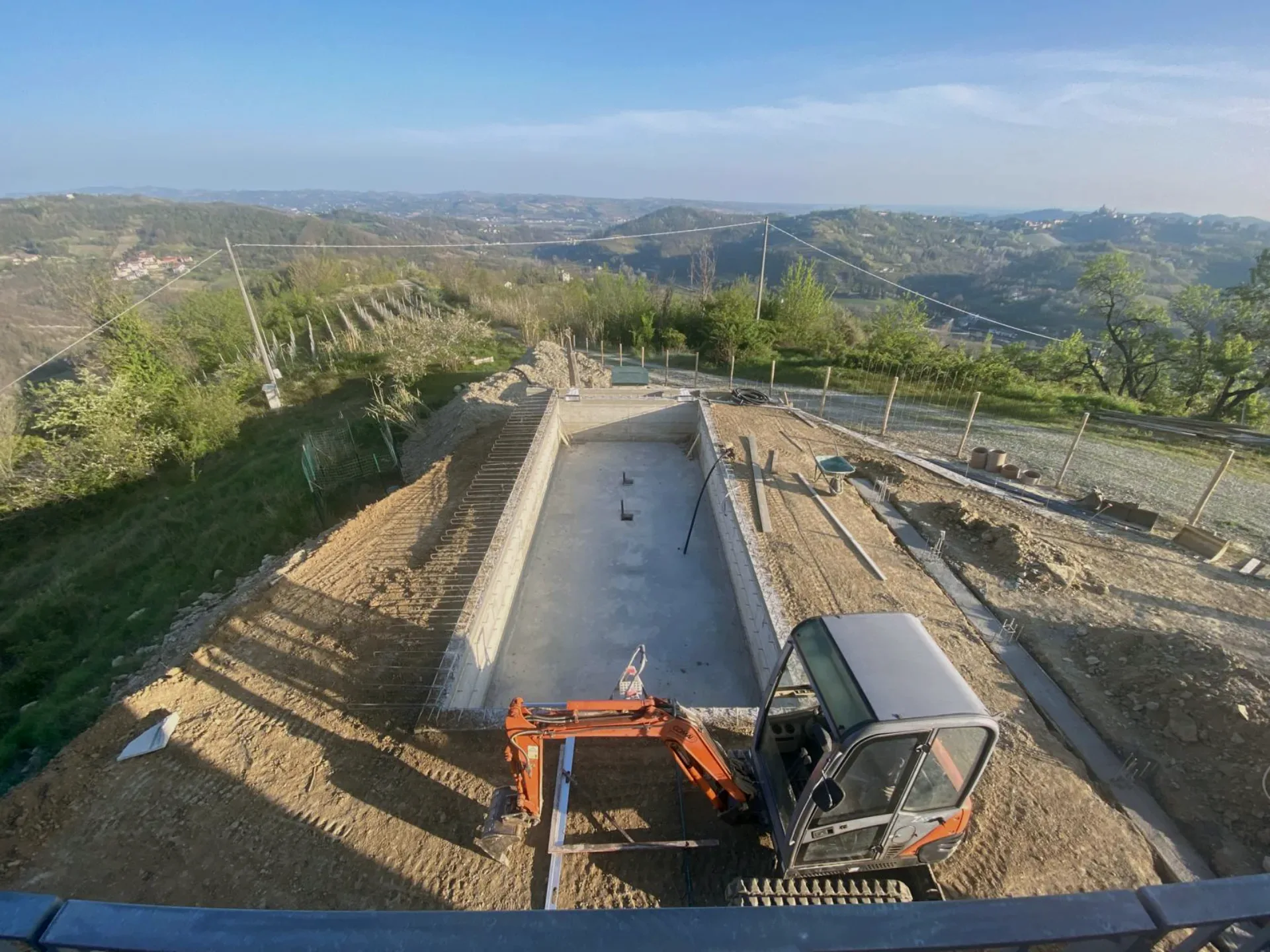 Cutting the access road into the hill